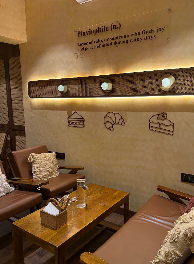 The Pluvian cozy interior with warm golden ambience and rustic decor